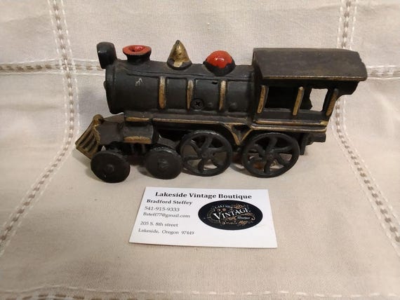 Vintage cast iron train locomotive, likely part of a "Washington" or "Pennsylvania Rail Road" set.