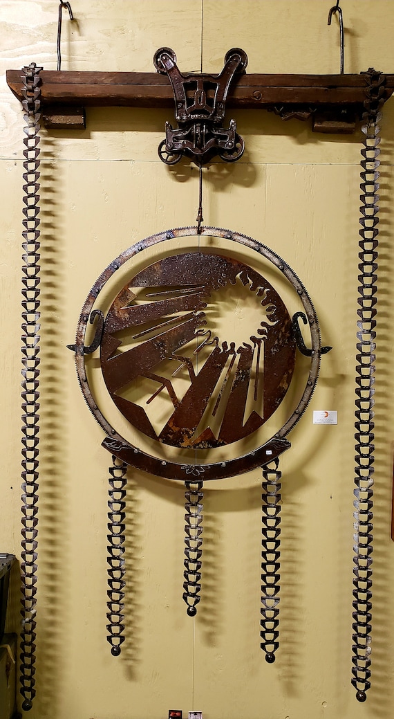 Blazing Sun Skulpture, industrial upcycled wall art by Lonnie Davison