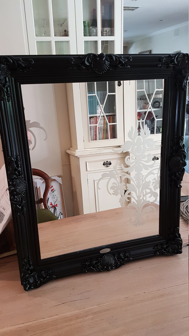 Black Ornate Framed Mirror With Silver Motive