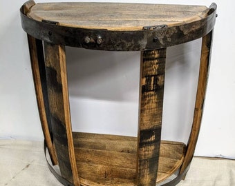 May include: A half-round wooden table with a metal frame and a lower shelf. The table is made from reclaimed wood and has a rustic, industrial look.