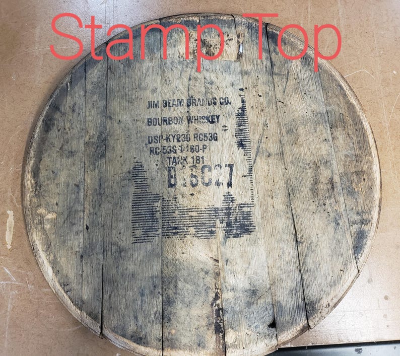 May include: A wooden barrel top with the text "JIM BEAM BRANDS CO. BOURBON WHISKEY DS-KY236 RC53G RC-535 1180-P TANK 181" printed on it.