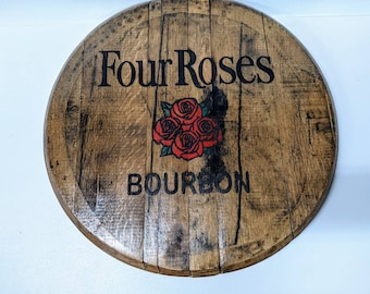 May include: A round wooden sign with the words "Four Roses Bourbon" and a red rose graphic.