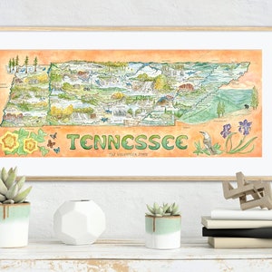 Könnte beinhalten: Eine Aquarell-Illustration des Bundesstaates Tennessee mit verschiedenen Sehenswürdigkeiten und Naturmerkmalen. Die Karte ist von einem hellorangenen Rand umgeben und enthält den Text "Tennessee, The Volunteer State".