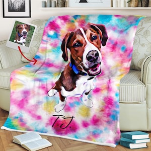 May include: A personalized throw blanket featuring a colorful tie-dye design with a portrait of a dog. The dog is brown and white, wearing a blue collar. The blanket has the name "P.J." in a handwritten font.