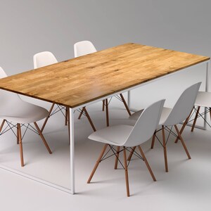 May include: A rectangular wooden dining table with a light brown finish, supported by a white metal frame. Six white plastic chairs with wooden legs and black wire supports surround the table, creating a modern dining set.