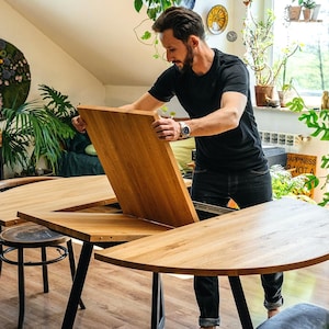 Extendable/non-extendable round oak dining table, handcrafted Scandinavian table, FJÄRIL BLACK (available with a Swiss edge)
