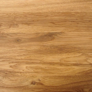 May include: Close-up of a light brown wood grain surface. The wood has a natural, warm tone and a smooth texture.