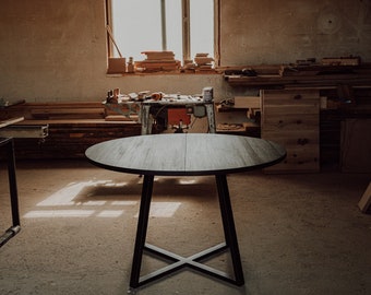 Black round extendable dining table, made of oak wood and steel. MÅNE BLACK II. Boho, vintage style. Handmade solid wood furniture