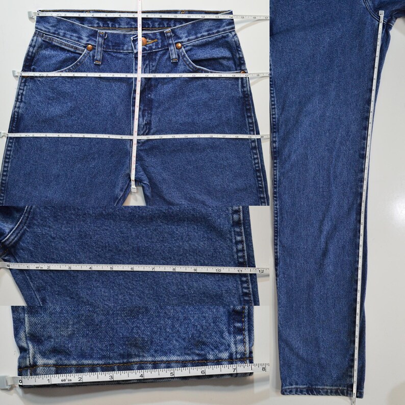 May include: A pair of blue denim jeans with a straight leg fit. The jeans have a button fly and belt loops. The jeans are measured in inches.