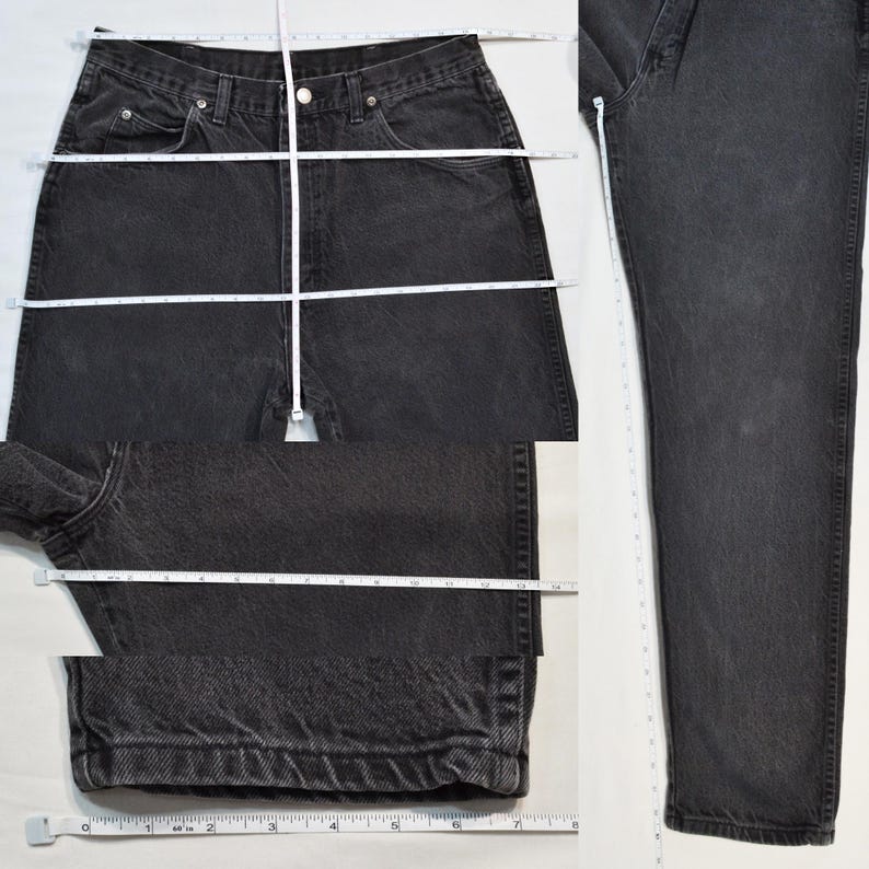May include: Black denim jeans with a classic five-pocket design. A white measuring tape shows the waist, inside leg, and leg opening measurements. The jeans are laid flat on a white surface for measurement.