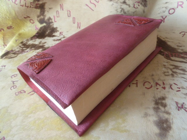 217-Simple book cover in red goatskin, with printed leather inserts in the corners, for all paperback books (up to 5.5 cm)