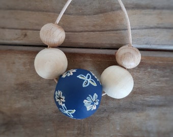 Blue beaded necklace with hand painted floral bead