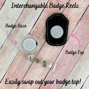 May include: Interchangeable badge reels with a badge base and badge top. The badge base is clear with a white circular velcro patch. The badge top is black with a white circular velcro patch. Text reads: "Easily swap out your badge top!"