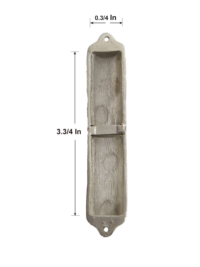 May include: A silver-coloured mezuzah case with a rectangular shape and a decorative design. The case is 3 3/4 inches tall and 0.3/4 inches wide.