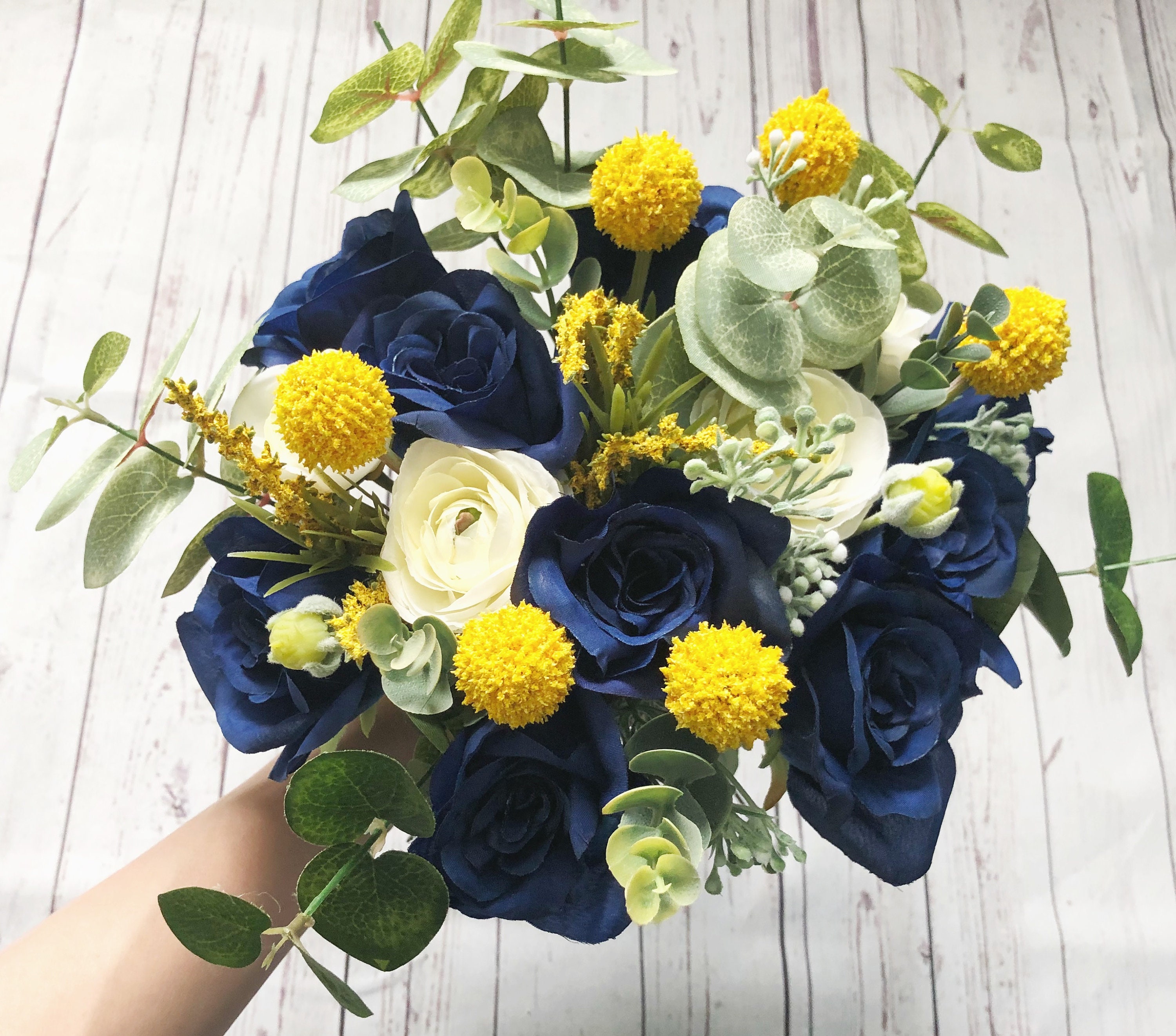 navy and yellow polka dot wedding favors with navy and yellow roses