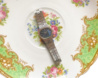 Bulova N5 Women's Watch, Oval Blue Watch Face with Stainless Steel Strap Swiss Movement Not Tested