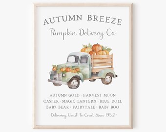 May include: A framed wall art print featuring a watercolor illustration of a light green vintage truck carrying orange pumpkins. The text reads: AUTUMN BREEZE Pumpkin Delivery Co. AUTUMN GOLD, HARVEST MOON, CASPER, MAGIC LANTERN, BLUE DOLL, BABY BEAR, FAIRYTALE, BABY BOO - Delivering Coast to Coast Since 1952 -.