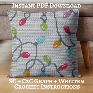 May include: A crocheted pillow with a light gray background and a colorful string of Christmas lights design. The lights are in various colors, including red, green, blue, and yellow. The text "INSTANT PDF DOWNLOAD" and "SC + C2C GRAPH + WRITTEN CROCHET INSTRUCTIONS" are displayed.
