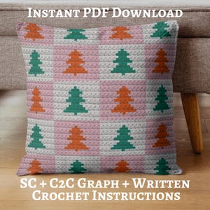 May include: A square crochet pillow with a repeating pattern of Christmas trees in orange and green on a pink and white checkered background. The text "INSTANT PDF DOWNLOAD" is at the top, and "SC + C2C GRAPH + WRITTEN CROCHET INSTRUCTIONS" is at the bottom.