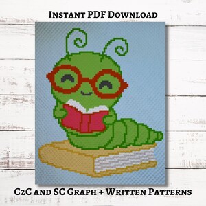 May include: A green caterpillar wearing red glasses, reading a pink book, and sitting on a tan book. The image is a crochet pattern with the text "INSTANT PDF DOWNLOAD" and "C2C AND SC GRAPH + WRITTEN PATTERNS".