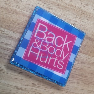 Back and Body Hurts Badge Reel