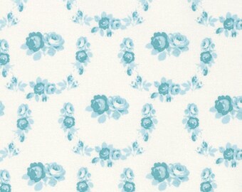 May include: A white background with a repeating pattern of blue floral wreaths. The wreaths are made up of small blue roses and leaves.