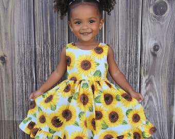 Vestido de algodón con estampado de girasoles, ideal para fiestas y bodas.