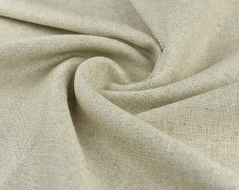 May include: Close-up of a beige linen fabric with a textured weave. The fabric is folded and draped, creating soft folds and curves.
