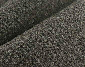 May include: Close-up of a dark gray textured fabric with a slightly rough surface.