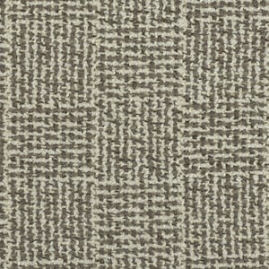 May include: A close-up of a brown and beige textured fabric with a geometric pattern.