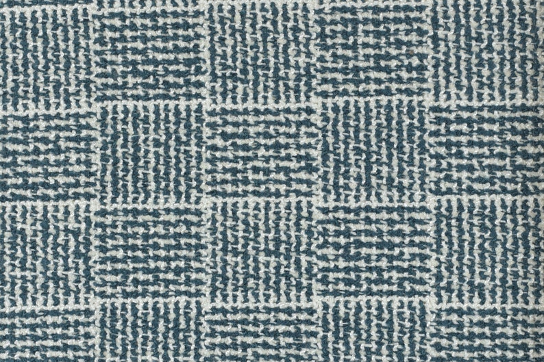May include: A close-up of a blue and white patterned fabric with a woven texture.