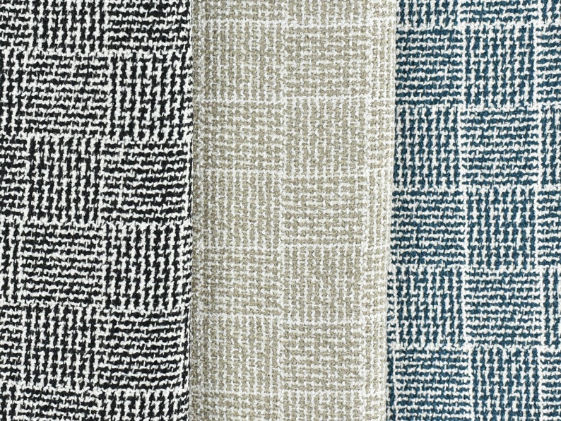 May include: Three fabric swatches with a geometric pattern. The swatches are black and white, beige, and blue.