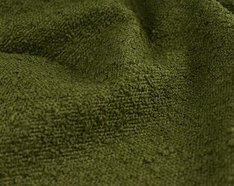 May include: Close-up of a textured green fabric with a soft, fuzzy surface.
