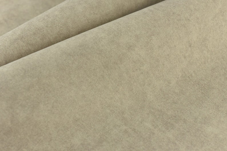 Puede incluir: Primer plano de una tela beige claro con una superficie ligeramente texturizada.