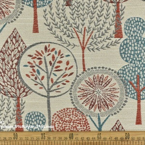 May include: A fabric swatch with a repeating pattern of stylized trees in shades of red, blue, and gray on a cream background. The fabric is 55 inches wide and is made of 89% polyester, 8% rayon, and 3% linen.