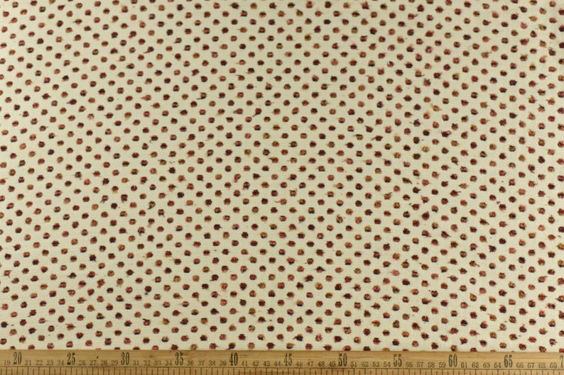 May include: White fabric with a repeating pattern of small, brown dots. The dots are arranged in a diagonal pattern.