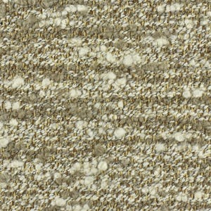 May include: Close-up of a textured fabric with a beige and white color scheme. The fabric has a woven appearance with small white flecks throughout.