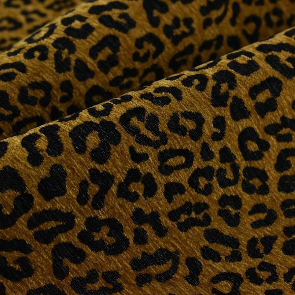 Tissu d'ameublement moderne en chenille noir et or à motif léopard | Tissu d'ameublement jacquard tissé avec des animaux exotiques pour meubles et oreillers