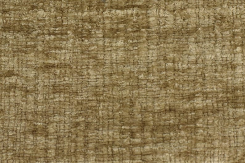 May include: A close-up of a textured fabric in a brown and beige colour scheme. The fabric has a woven appearance and a slightly rough texture.