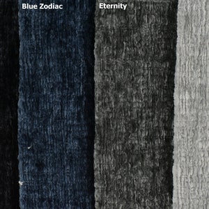 May include: Four fabric swatches in different colours: black, blue, grey, and light grey. The fabric has a textured, fuzzy appearance.