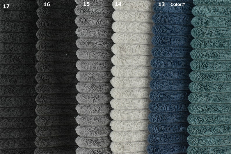 May include: Five fabric swatches in different colours: black, grey, white, blue, and teal. The fabric has a corduroy texture.