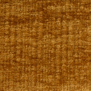 May include: Close-up of a textured fabric in a deep golden brown colour. The fabric has a slightly fuzzy texture.