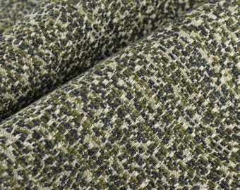 May include: Close-up of a green and black patterned fabric with a woven texture.