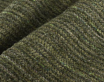 May include: Close-up of a textured green fabric with a subtle woven pattern. The fabric has a slightly rough feel and a deep, rich green color.