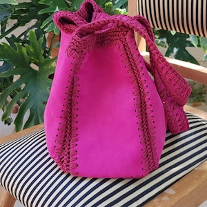 Suede leather crochet shoulder bag, fuchsia color