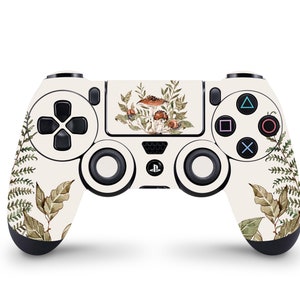 May include: A white PlayStation 4 controller with a forest-themed design. The controller features a pattern of green leaves and brown mushrooms.