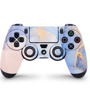 May include: A blue and pink PlayStation 4 controller with a marble pattern and gold accents.