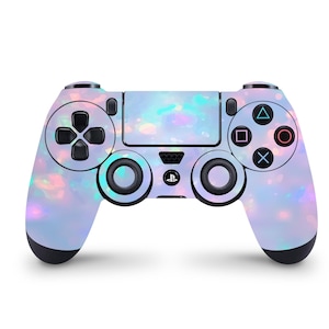 May include: A white and iridescent PlayStation 4 controller with black buttons and a PlayStation logo.