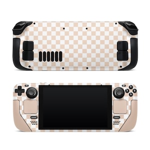 May include: A beige and white checkered handheld gaming console with black buttons and a black screen.