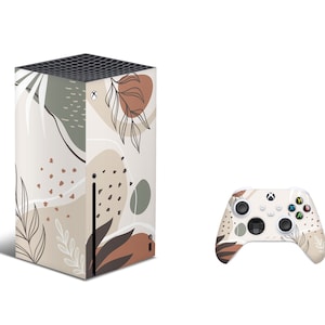 Puede incluir: Una consola Xbox Series X blanca con un diseño floral abstracto beige y marrón. La consola está junto a un mando Xbox blanco a juego con el mismo diseño.